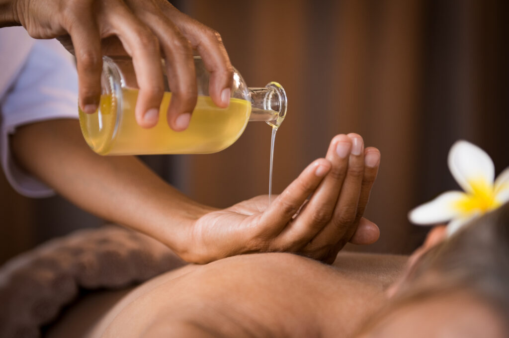 Woman pouring skincare oil into her hand